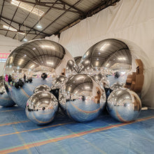 Load image into Gallery viewer, Silver inflatable mirror balls creating stunning disco ball effect at birthday party celebration