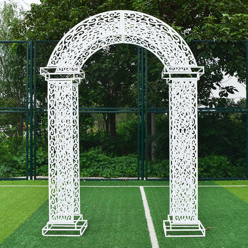 Metal arch backdrop for indoor wedding events