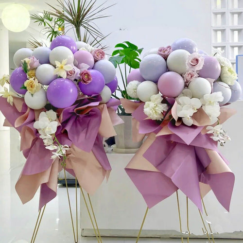 Purple balloon stand bouquets for a birthday party